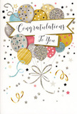 The card in this image captures the essence of a joyful celebration, the kind that might follow exciting news shared with family and friends in Farnborough. Standing upright, it displays a central burst of illustrated balloons that feels like a bouquet taking flight. The balloons vary in size and pattern, painted in a harmonious blend of warm gold, soft silver, champagne, airy sky blue, blush pink and gentle grey. Some balloons appear smooth and polished, others are adorned with delicate metallic stars, fine stripes or tiny speckles, giving the impression of light playing across textured surfaces, much like party decorations under soft evening lights. From the cluster, slender ribbons in shimmering gold and silver tumble gracefully downward, curling and looping as they fall, evoking the carefree energy of a party at home or in a local Farnborough hall. A gracefully arched banner stretches across the midsection of the card, lightly overlaying a few balloons and carrying the words Congratulations To You in an elegant, flowing script that feels sincere and celebratory. Around this central motif, sprinkled stars, confetti dots and swirling flourishes drift through a pale, softly glowing background, adding a sense of depth and movement, as if the scene is gently floating in air. The mood is one of lightness, gratitude and pride all at once, perfectly suited to moments when someone's effort has truly paid off. It is easy to imagine this card placed beside a hand-crafted bouquet from Flowers Farnborough on a kitchen counter or dining table, the sparkle of the illustrated balloons echoing the joy of fresh blooms as you mark a special milestone.